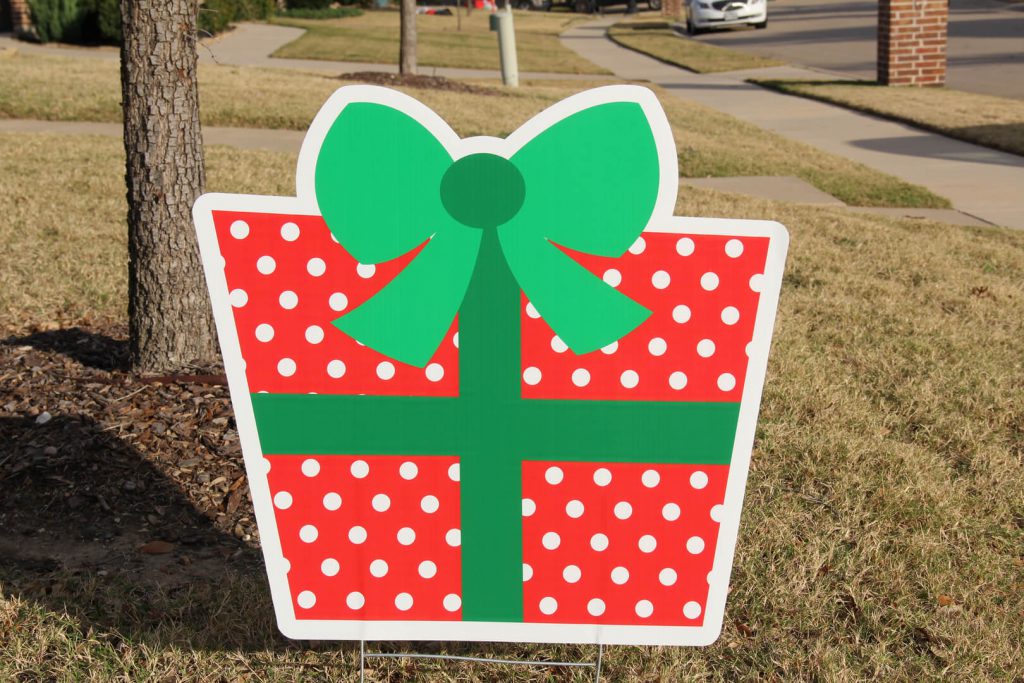yard sign of Christmas present