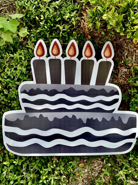 A black birthday cake