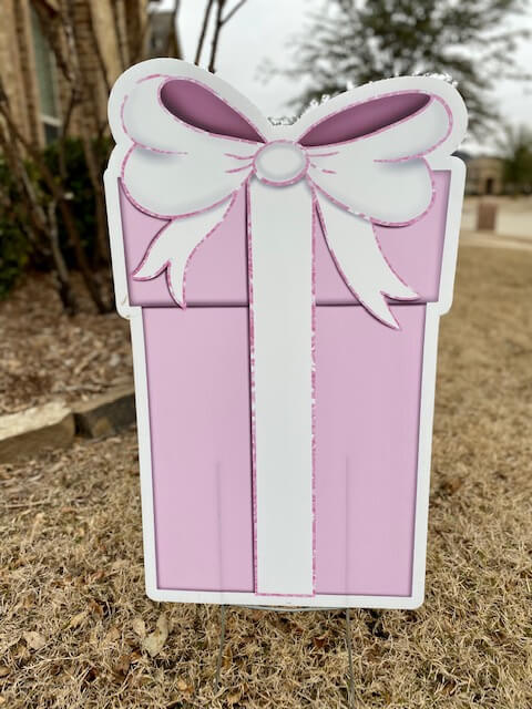 Pink gift box with white bow