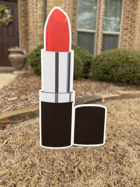 Red lipstick in a black and chrome case